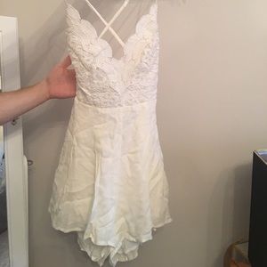 Lulu’s ivory backless lace romper
